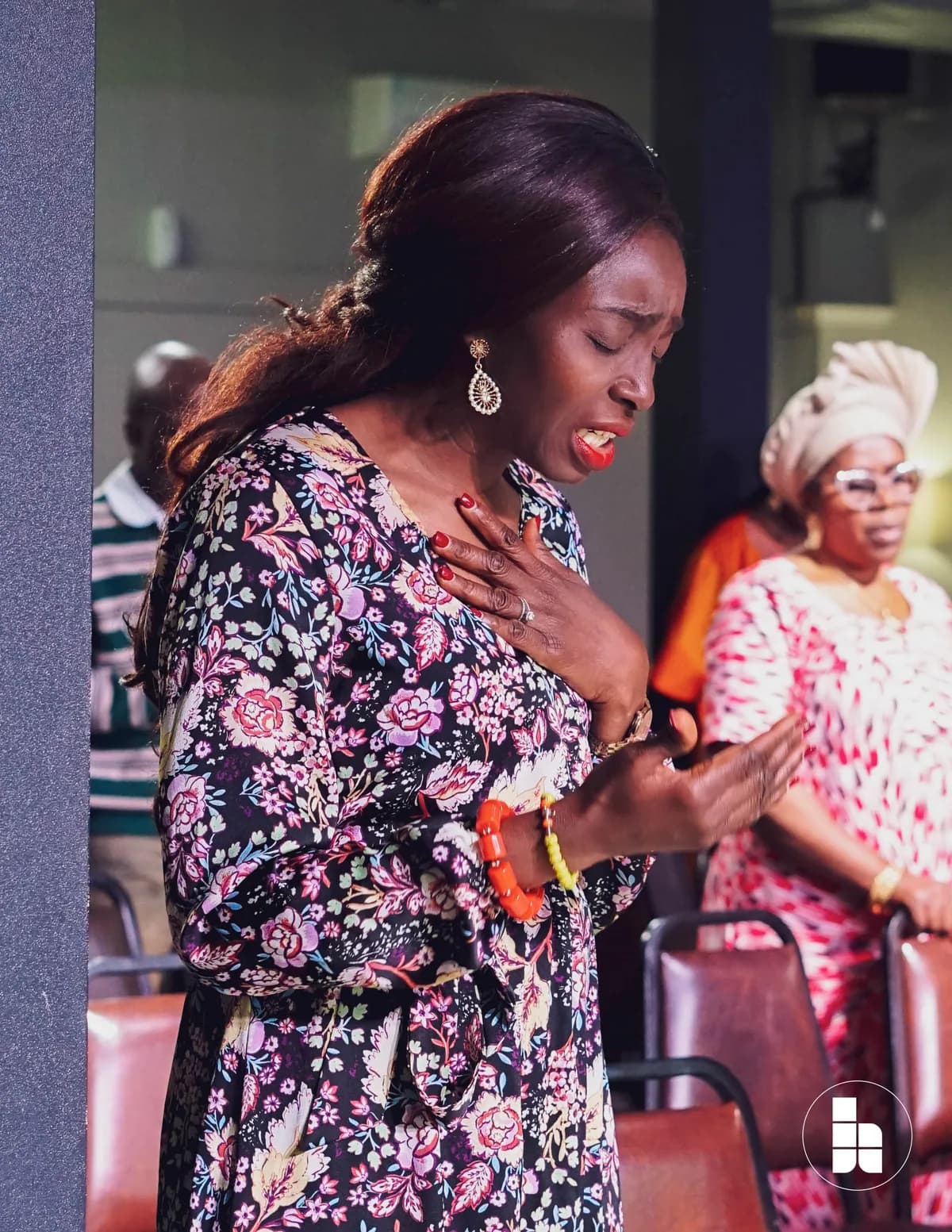 Members praying together during a service