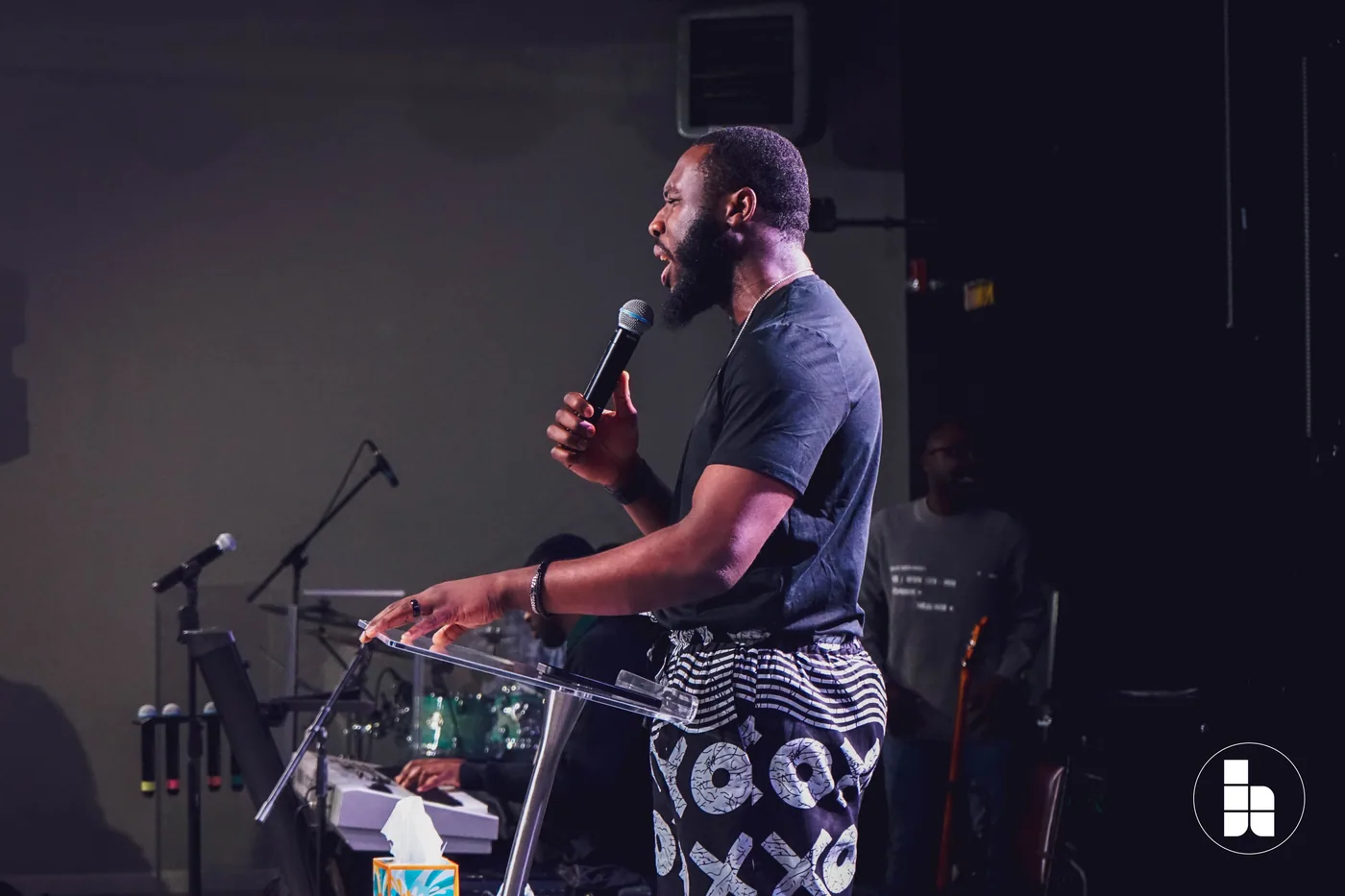 A member leading the congregation in prayer