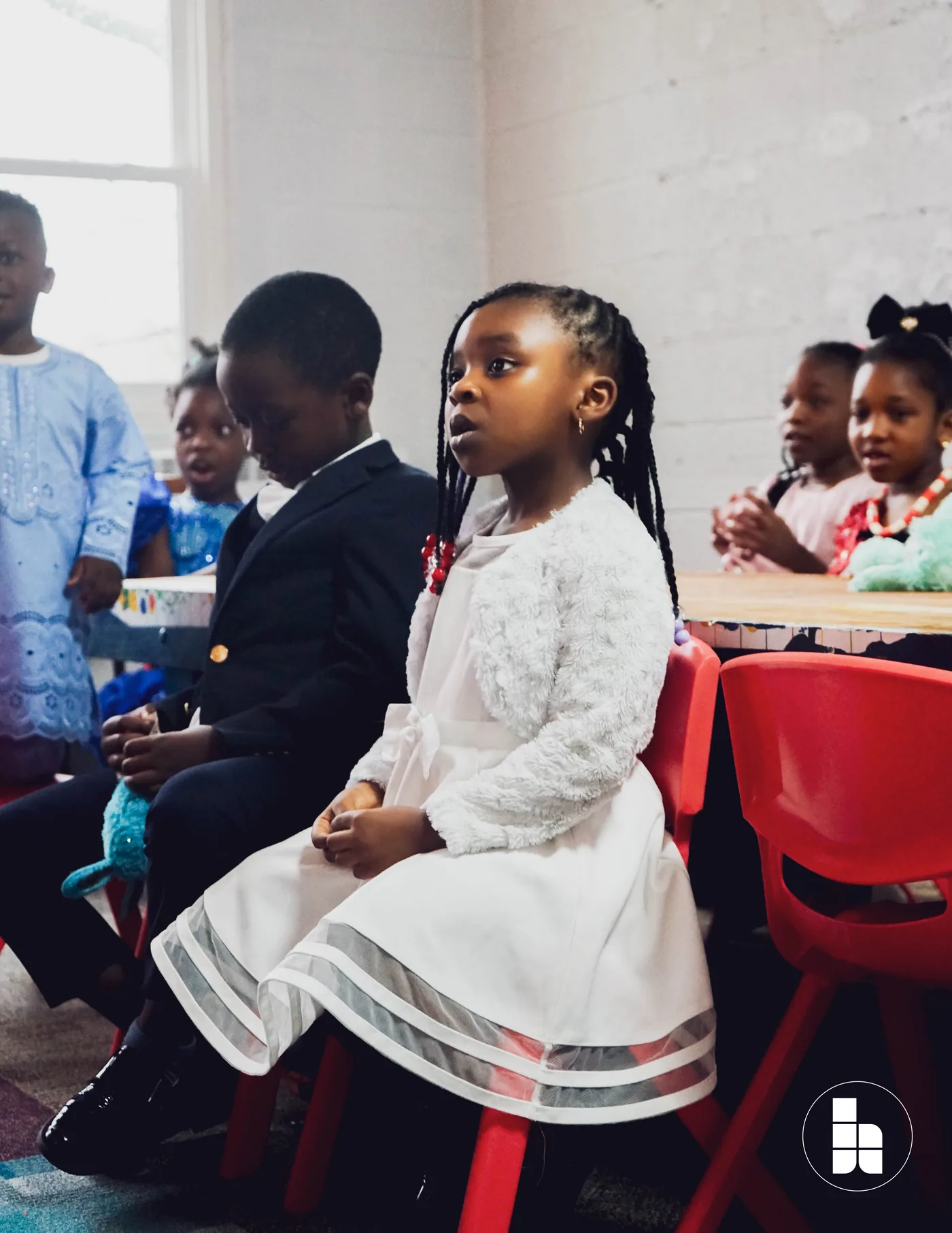 Younger children seated together during a Jubilee Kids session